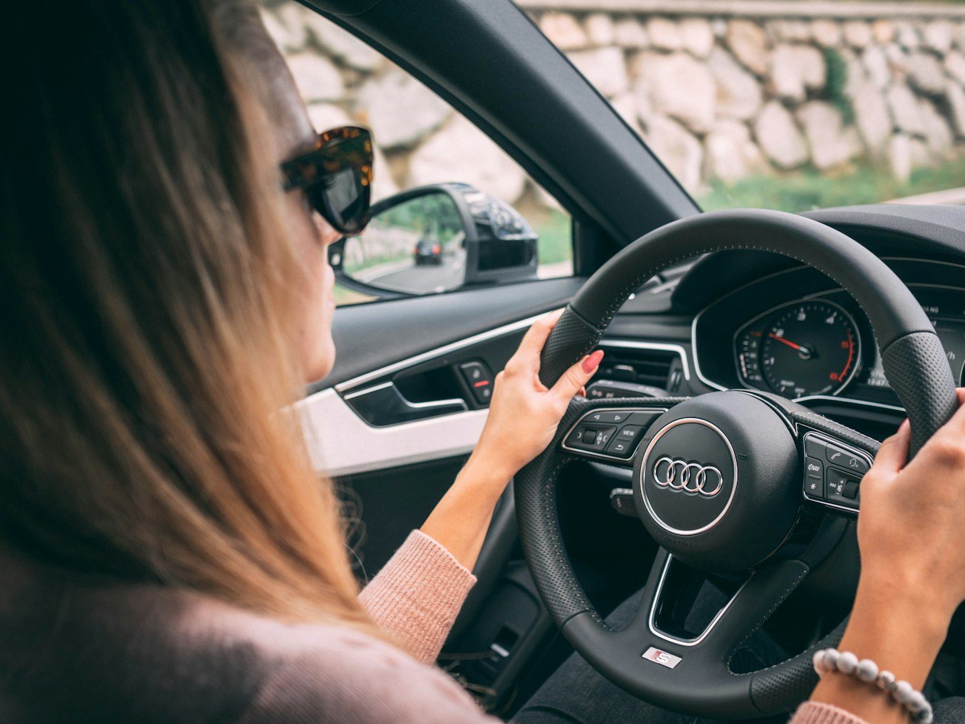 Woman driving a car on a sunny day
